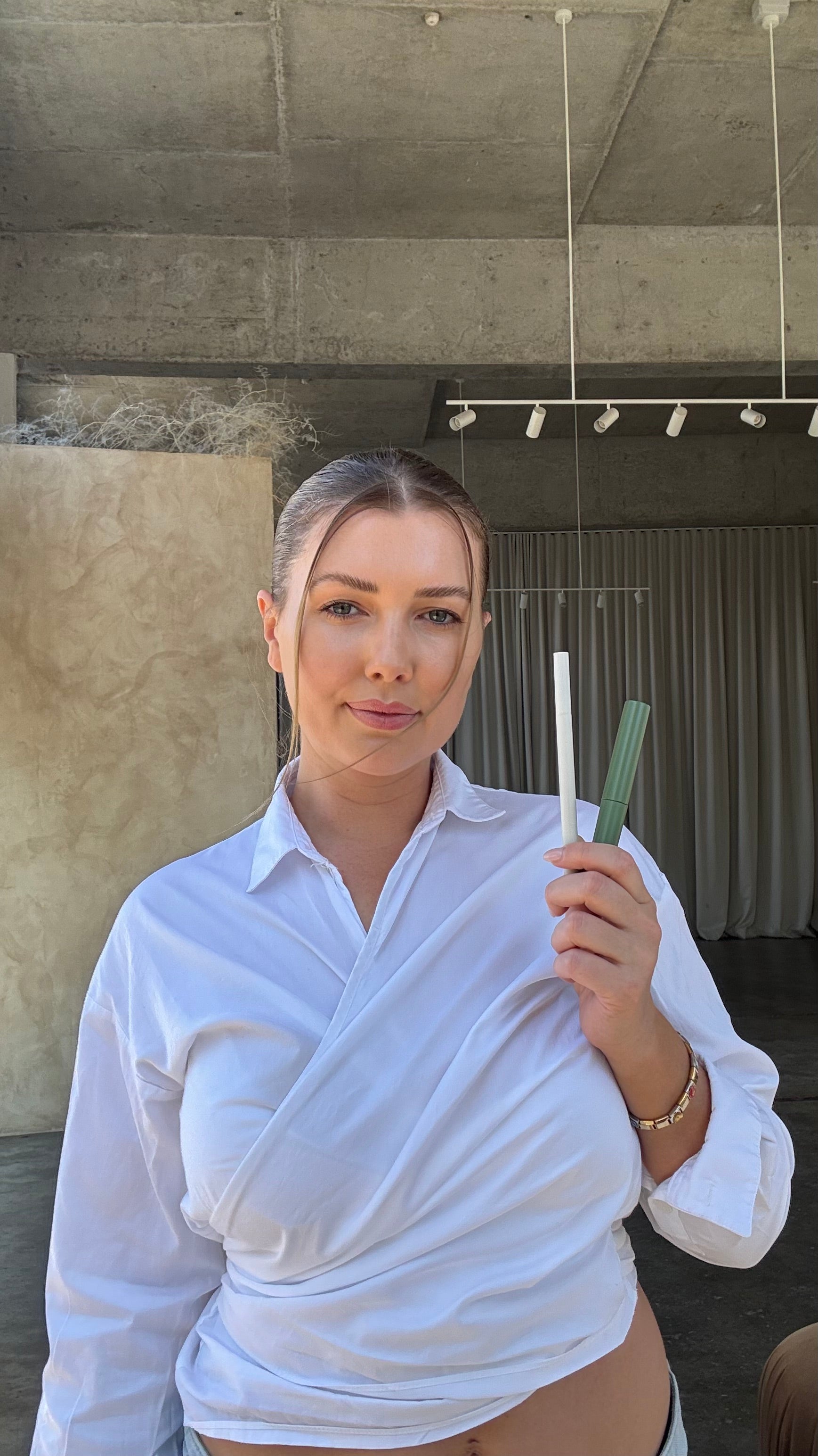 Founder holding products